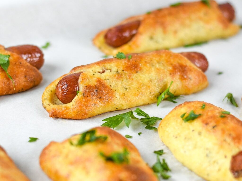 sweetketolife.com-fathead-pigs-in-a-blanket-recipe-puffy