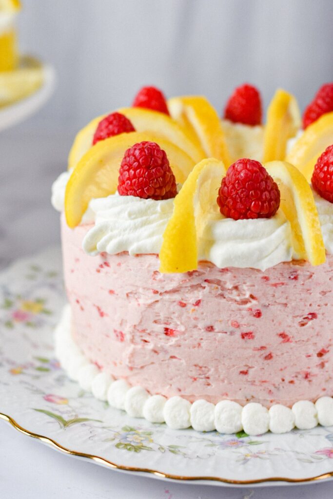 sweetketolife.com-keto-lemon-cupcakes-with-keto-raspberry-jam-filling-layer-cake-pipping